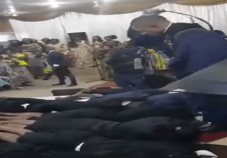 Kunyorosha dhambi– A rogue PASTOR caught on camera whipping his congregants like toddlers with an ‘anointed belt’ (VIDEO).